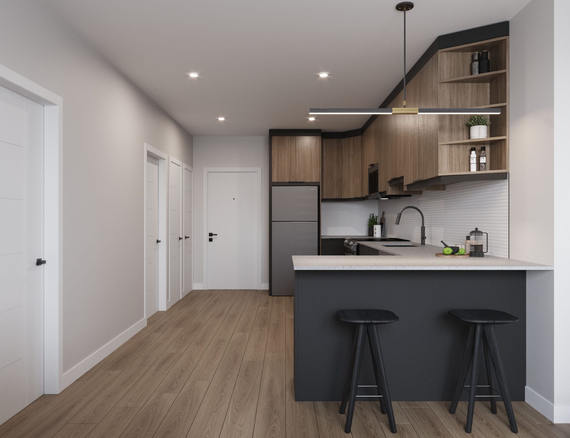 Kitchen with breakfast bar and bar stools. Located at The Cornerstone.